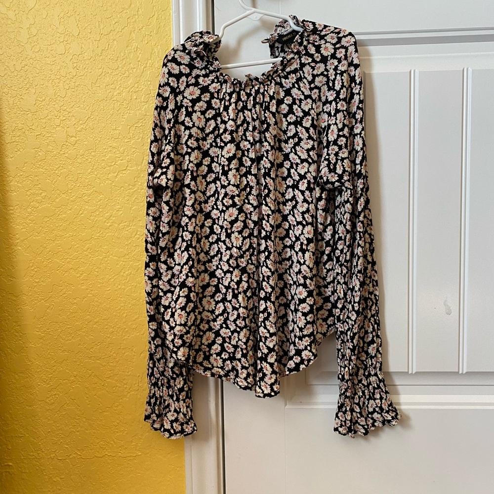 Shirt is a small and it is lose and flowy